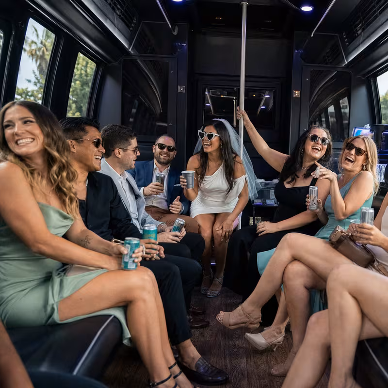 Party bus interior with wraparound leather seating and LED lighting in Encinitas
