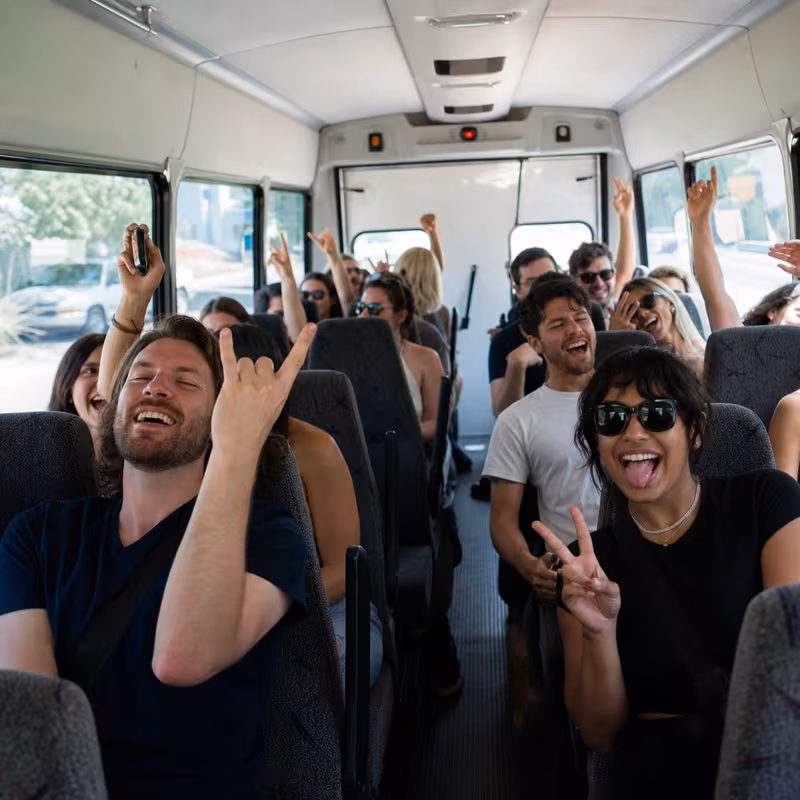 Party bus interior with wraparound leather seating and LED lighting in Encinitas
