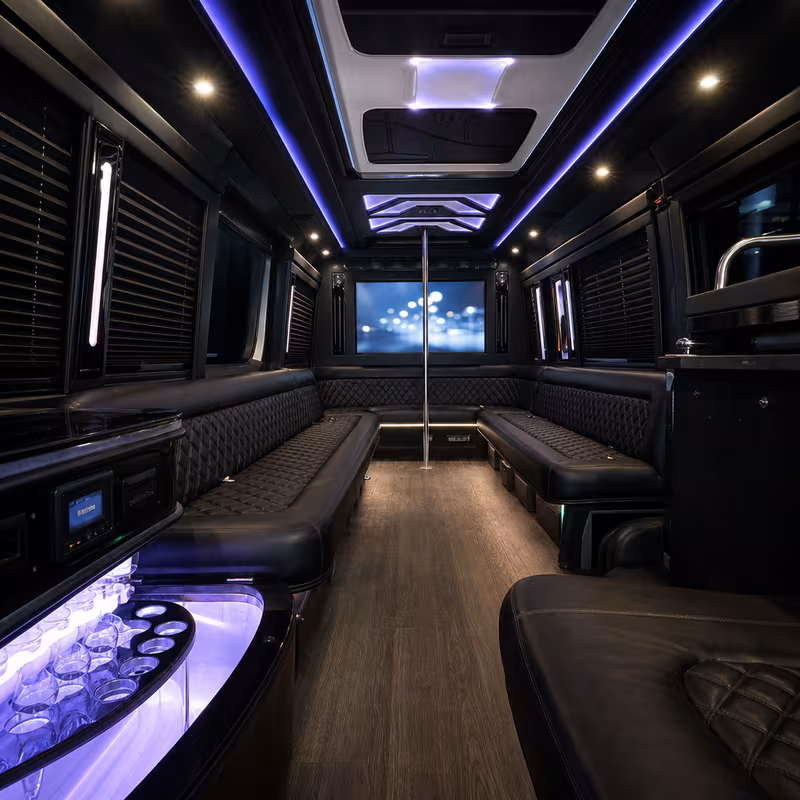 Party bus interior with wraparound leather seating and LED lighting in Encinitas