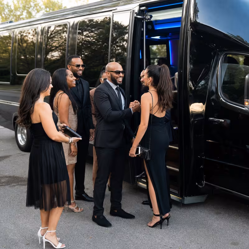 Passengers loading luggage while boarding an Encinitas group shuttle