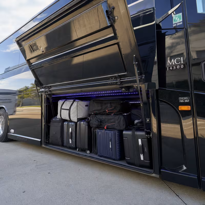Party bus interior with wraparound leather seating and LED lighting in Encinitas