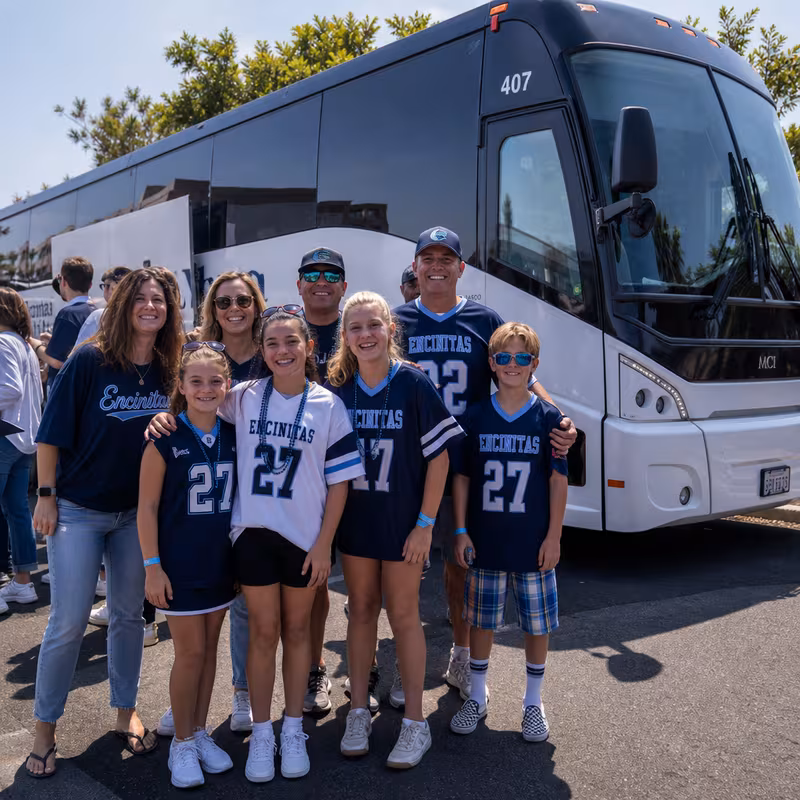 Passengers loading luggage while boarding an Encinitas group shuttle