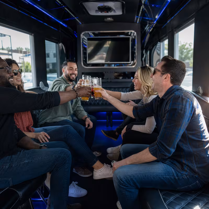 Group boarding a white charter bus for Winery & Brewery Tour Transportation transportation in Encinitas